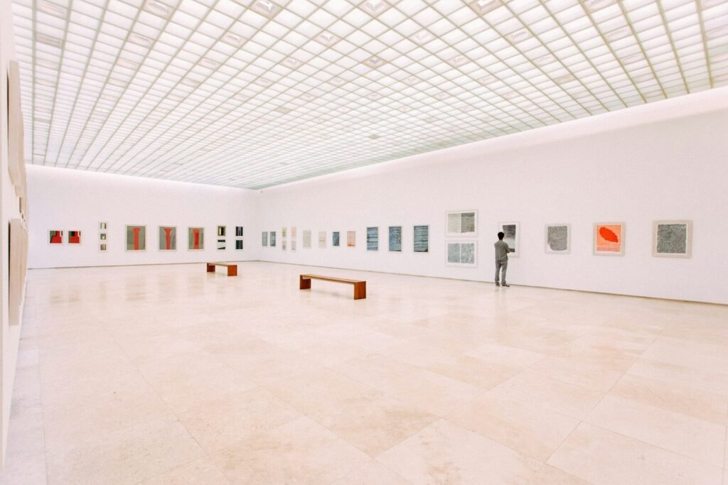 person looking at painting, art, gallery, museum, music, sound