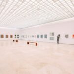 person looking at painting, art, gallery, museum, music, sound