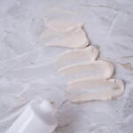 white shell on white sand, moisturizer, beauty