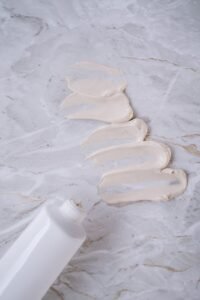white shell on white sand, moisturizer, beauty