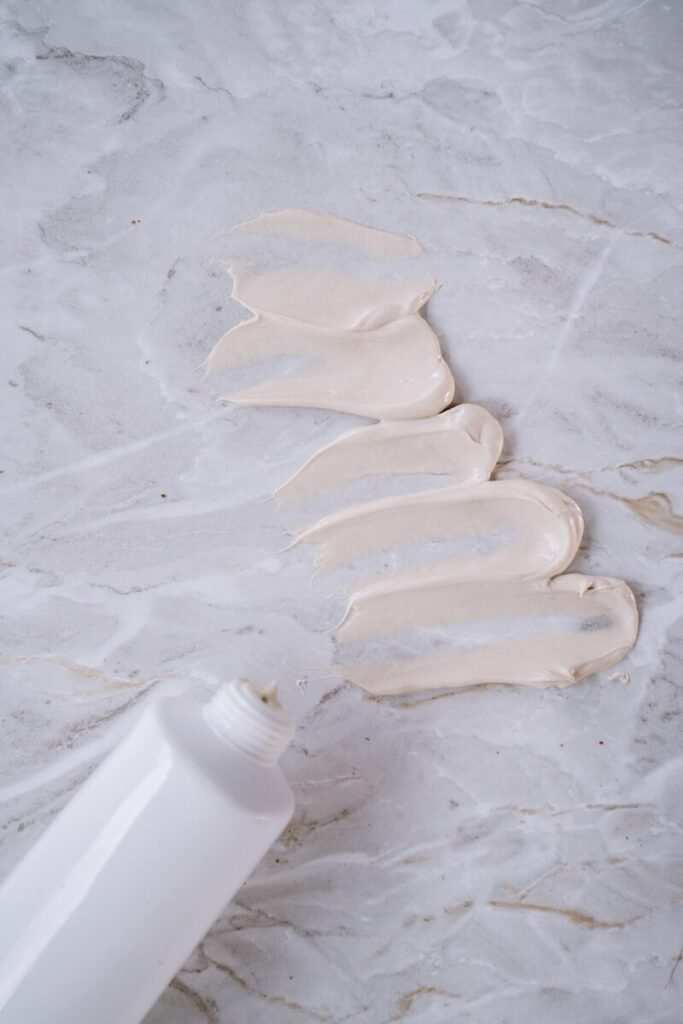 white shell on white sand, moisturizer, beauty