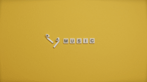 Minimalist image of AirPods and music-themed letter tiles on a vibrant yellow background. plays
