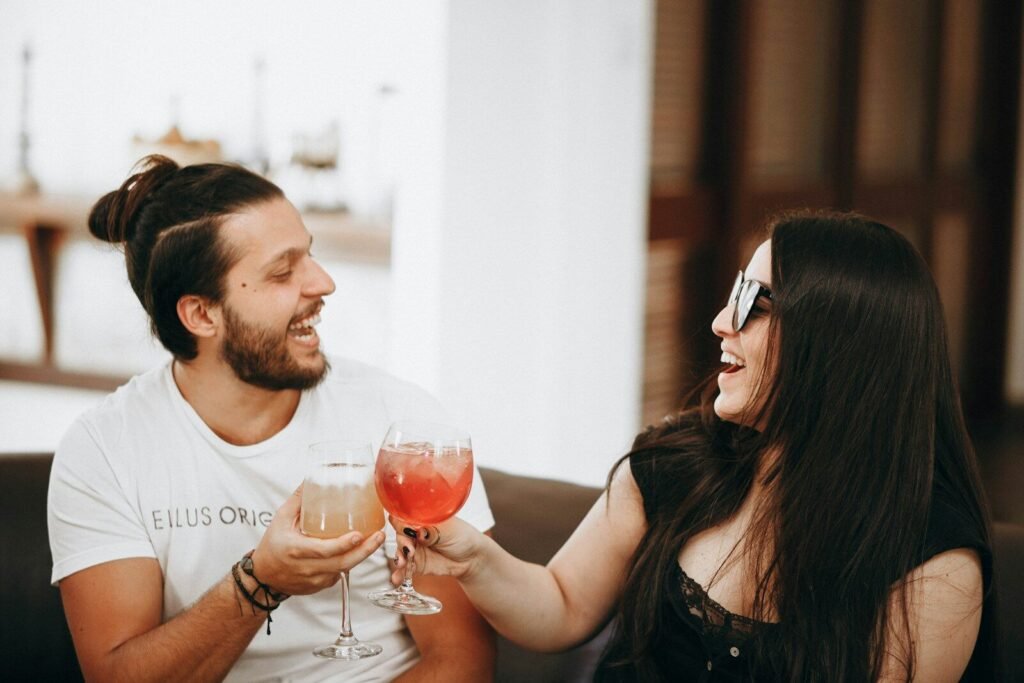 DC Cafe Love on the Clock- Speed Dating for the Bold & Curious Singles 2 man in black tank top holding wine glass, Come mingle and meet new people at our in-person speed dating event for singles