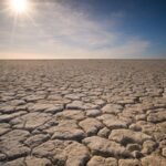 the sun is shining over a vast expanse of land, drought