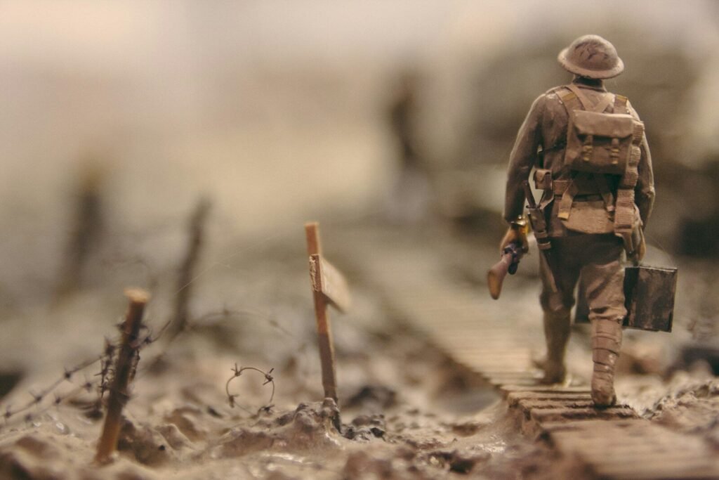soldier walking on wooden pathway surrounded with barbwire selective focus photography, D-Day