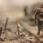 soldier walking on wooden pathway surrounded with barbwire selective focus photography, D-Day