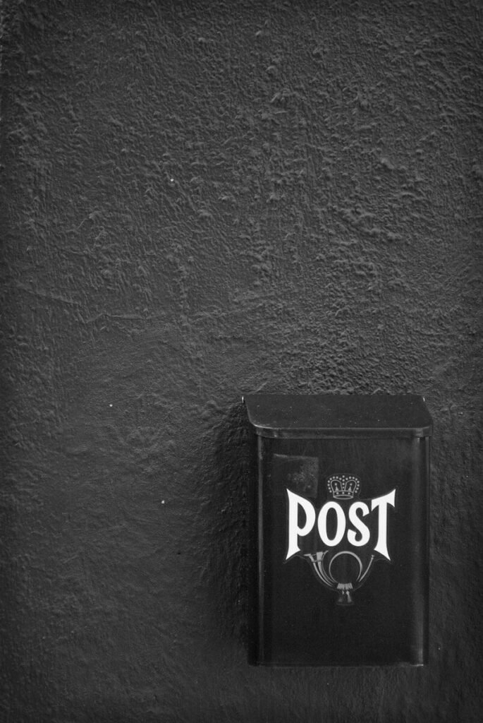 Sponsored Posts 1 a black and white photo of a post box, sponsored, post