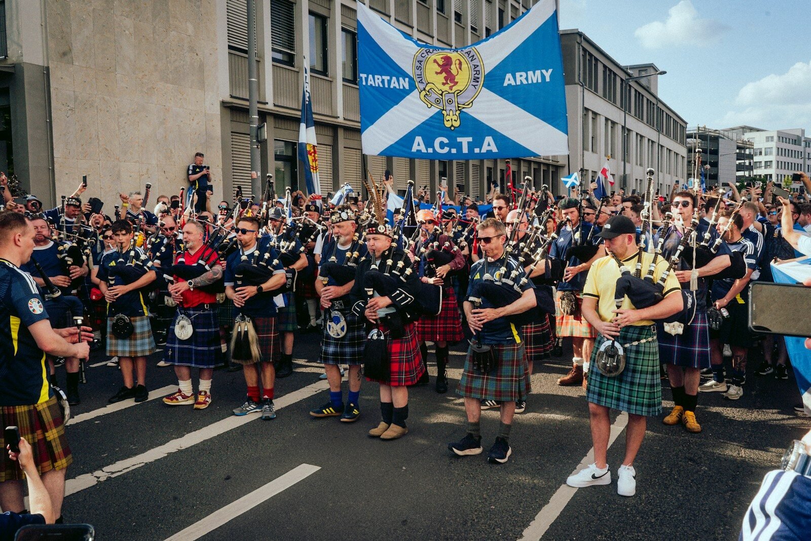 They Captured Hearts in the U.S. Now Scotland Is Ready to Capture Yours 1 A group of men in kilts standing in front of a crowd, Tartan Army, Scotland