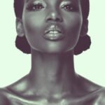 a woman with black hair and a silver make - up, beauty