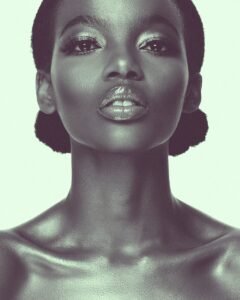 a woman with black hair and a silver make - up, beauty